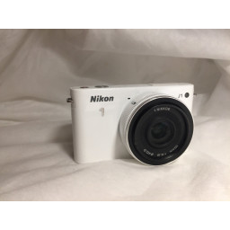 Замена объектива камеры Nikon J1